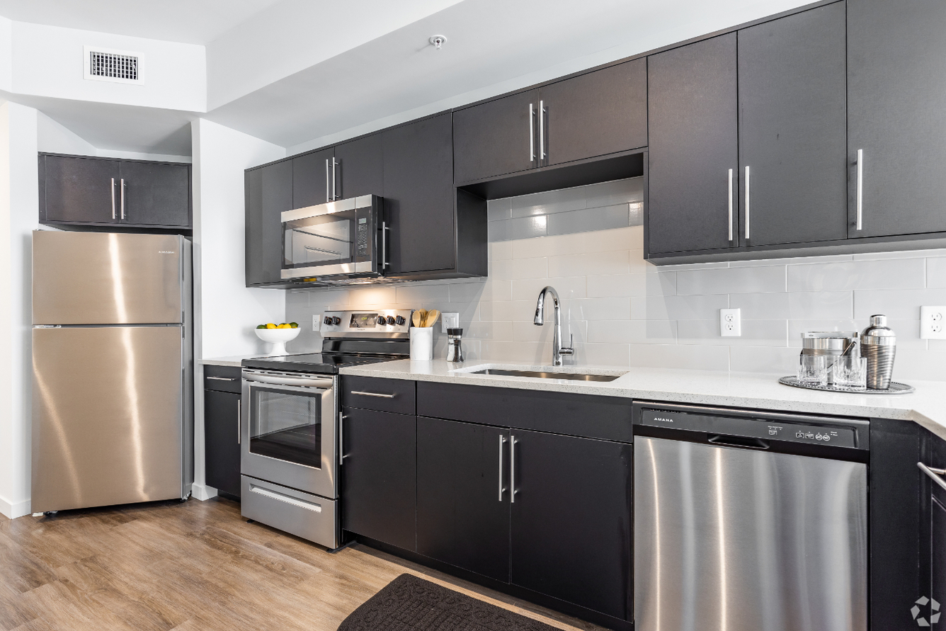 Radius Apartments kitchen with modern finishes - Orlando, FL